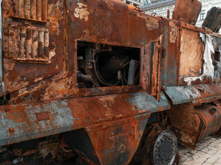 Destroyed Russian armored vehicle. Rusty armor of military equipment. Military conflict in Ukraine...
