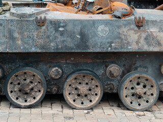 Destroyed Russian armored vehicle. Rusty armor of military equipment. Military conflict in Ukraine...