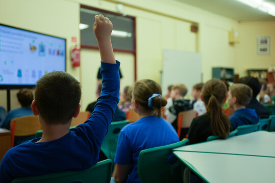 Children at school sitting actively participating