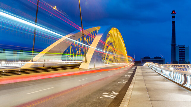 Light trail of a tram on the Troja Bridge in Prague at night, Czech Republic, long exposure