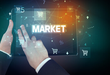 Close-up of a hand holding tablet with shopping inscription