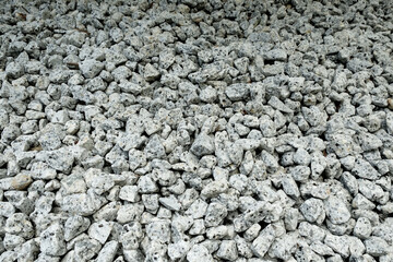 White stone texture pebble background.