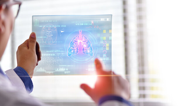 The doctor looks at the hologram of Lungs, Doctor holding and diagnose virtual Human Lungs with coronavirus spread inside on modern interface screen, Innovation and Medical tech