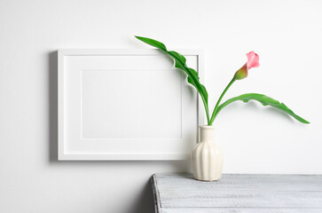 Horizontal white picture frame mockup with flowers