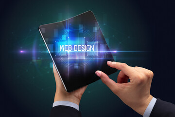 Businessman holding a foldable smartphone