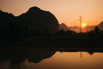 Thakhek, Laos - January 23rd, 2020 : sunset in the limestone karstic mountains of the scenic...