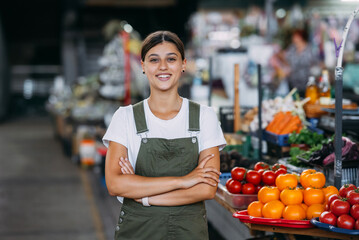 Woman seller at the counter with vegetables. Small business concept - 516147077