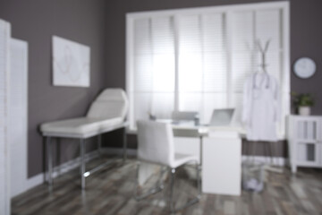 Fototapeta na wymiar Blurred view of modern medical office with doctor's workplace. Interior design