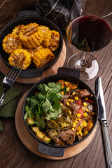 Beef Fajitas with colorful bell peppers in pan and tortilla bread grilled corn