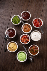 Mix from different kinds of sauces. On dark rustic background