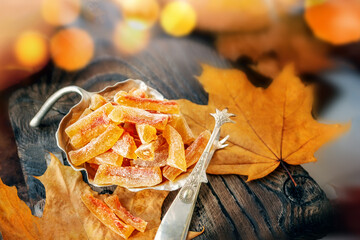 Dried candied pumpkin fruits. Preparation of natural farm homemade candied pumpkin fruits sprinkled with powdered sugar