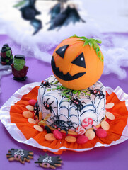 Halloween pumpkin party cake and spiders cookies.