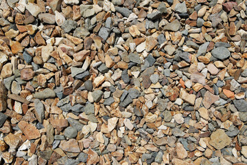 The texture of the surface covered with small rounded stones.