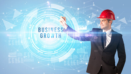 Handsome businessman with helmet drawing