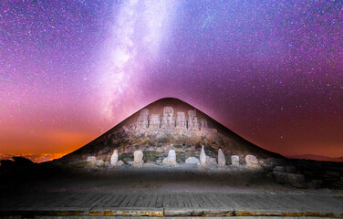 East terrace of Mount Nemrut at sunrise with Great alter in front of statues and the tumulus. The...
