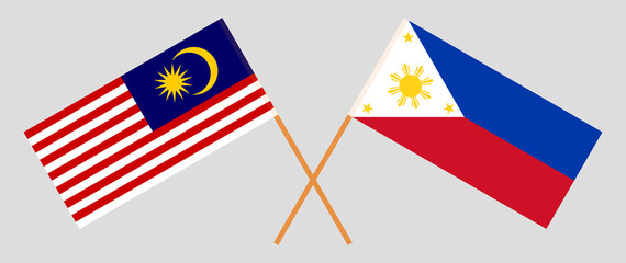 Crossed flags of Malaysia and the Philippines. Official colors. Correct proportion