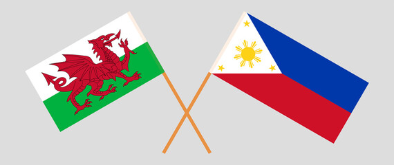 Crossed flags of Wales and the Philippines. Official colors. Correct proportion