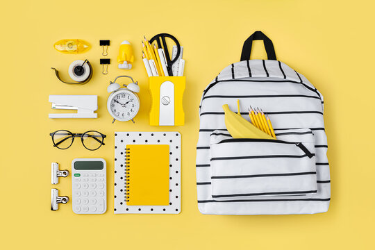 Black and white stationery on yellow background. School stationery supplies. Workplace organization. Concept back to school..