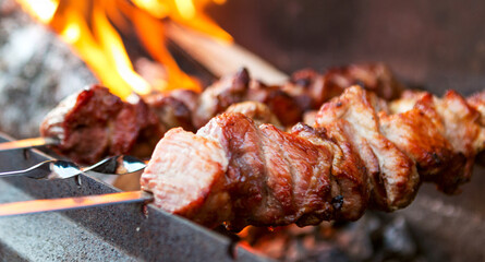 Meat grill against the background of fire