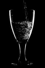 glass of water on black