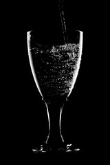 glass of water on black