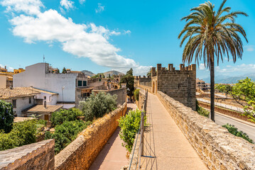 Fototapeta na wymiar Walls of the Porta del Moll fortress in the old town of Alcudia, Mallorca island