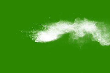 Explosion of white powder isolated on green background. Abstract colored background. holi festival.