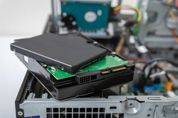 Closed-up view of SSD and spindle hard disks on top of business desktop PC