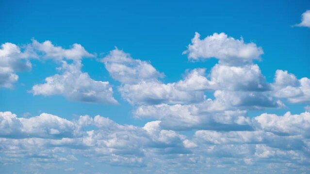 Timelapse of cumulus clouds moving in the blue sky. Light clouds change their shape in cloud space. Awesome sky. Background of cloudscape, time-lapse. Copy space. Change of weather. Nature. 4K
