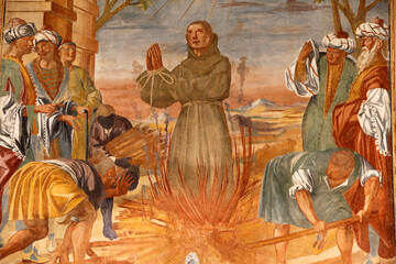Basilica di Santa Caterina, Galatina, Apulia.Fresco in the cloister : Franciscan monk on a pyre .Painted by Br. Joseph of Gravina in 1696