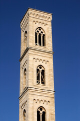 Fototapeta na wymiar Clock tower of the basilica di Santa Maria della Coltura, Parabita, Apulia