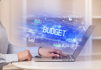 Closeup of businessman hands working on laptop