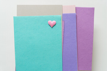 small pink fabric heart and blank paper