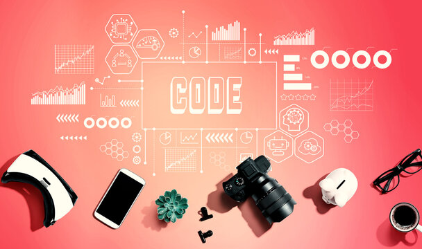 Code with electronic gadgets and office supplies - flat lay