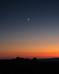 The sun set of the moon in the evening