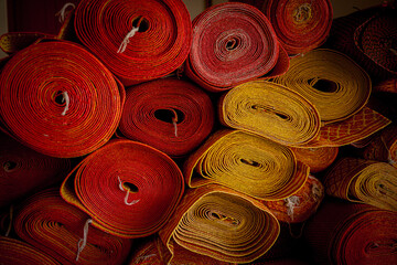 Old carpets rolled up rugs shop store