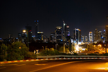 Fototapeta na wymiar night city road on the background of high-rise buildings. night city. night freeway. downtown