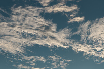Naklejka na ściany i meble Feather clouds on the bright blue sky