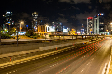 Fototapeta na wymiar night city road on the background of high-rise buildings. night city. night freeway. 