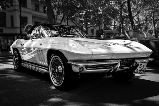BERLIN - JUNE 18, 2022: Sports car Chevrolet Corvette Sting Ray Convertible (C2), 1965. Black and white. Classic Days Berlin.