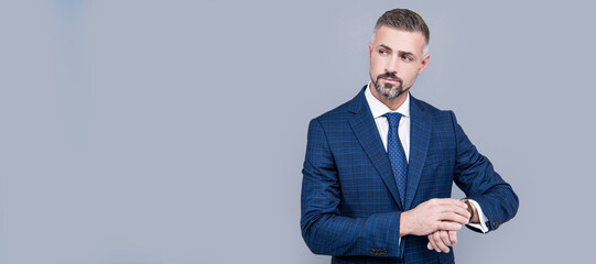 Man face portrait, banner with copy space. successful businessman man in businesslike suit cheking time on wristwatch, fashion accessory.