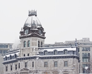 Tower of the neogothic building of the Old port corporation of Montreal in winter