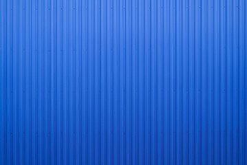 Empty exterior wall of warehouse made of Blue Corrugated metal texture surface or galvanize steel...
