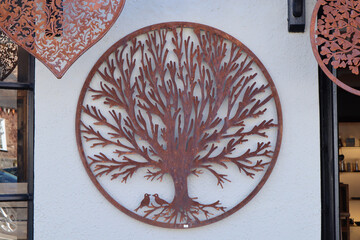 Intricate metal tree on sale in a shop in Dunster in Somerset, England