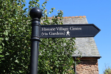 A signpost in Dunster, Somerset pointing to the historic village centre