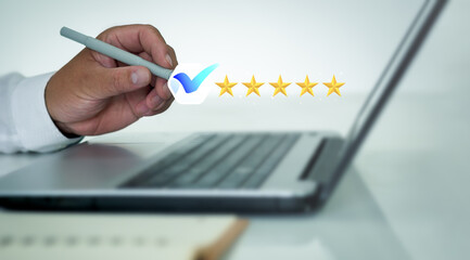 Businessman pressing face smiley face pen to display emoticons on virtual screens, surveys, polls,questionnaires for user experience, customer satisfaction research.Customer service evaluation concept