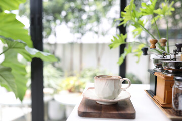 unique coffee cup and coffee utensil on white table indoor