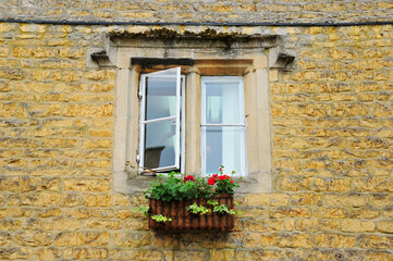 Fototapeta na wymiar Photo of a window on a brick wall