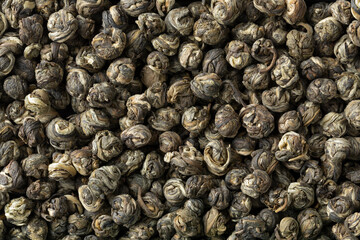 Chinese  Jasmine Dragon pearl tea close up full frame as background
