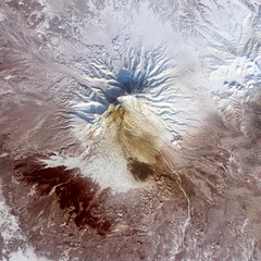 Top view of an erupted volcano. Ashes and remnants of a large flow on the slopes of volcano in...